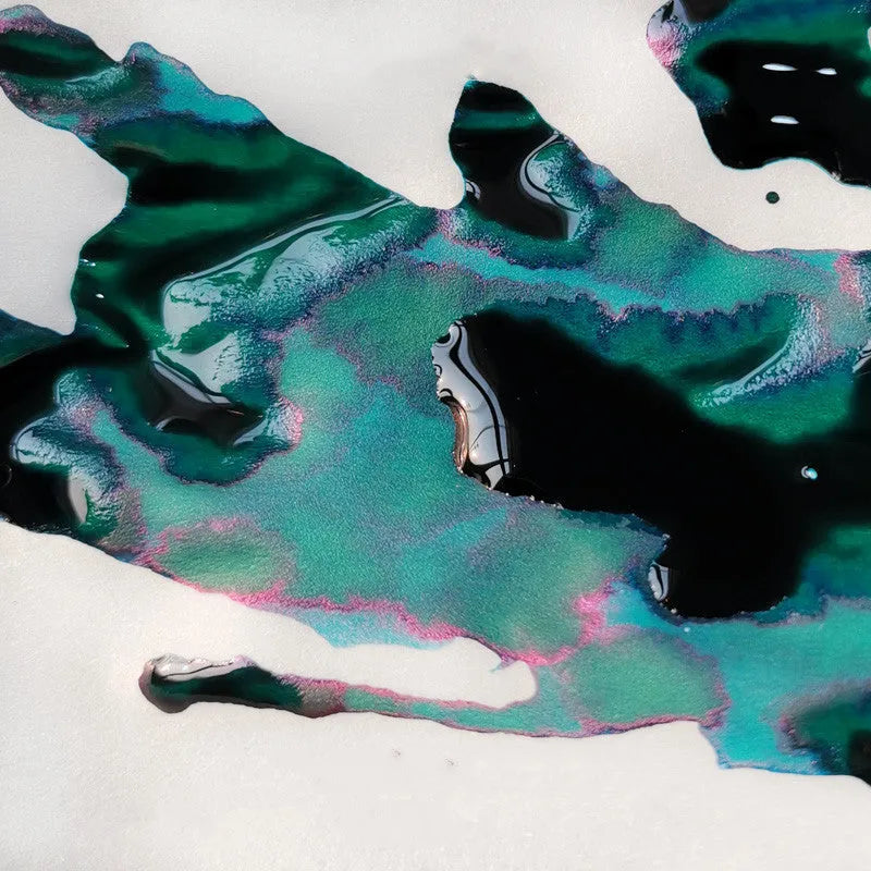 Bottle of strong sheen gradient fountain pen ink with gold powder particles in Red Tide or Truffle colour