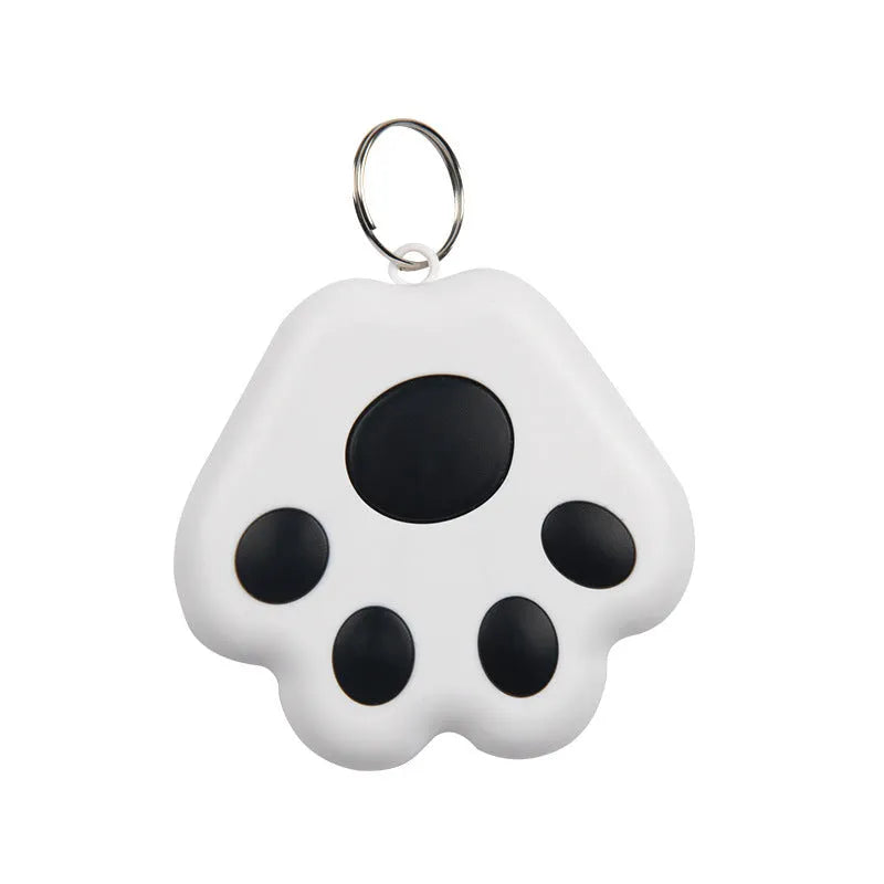 Small black dog paw shaped Bluetooth tracker device for finding phones and taking remote selfies.