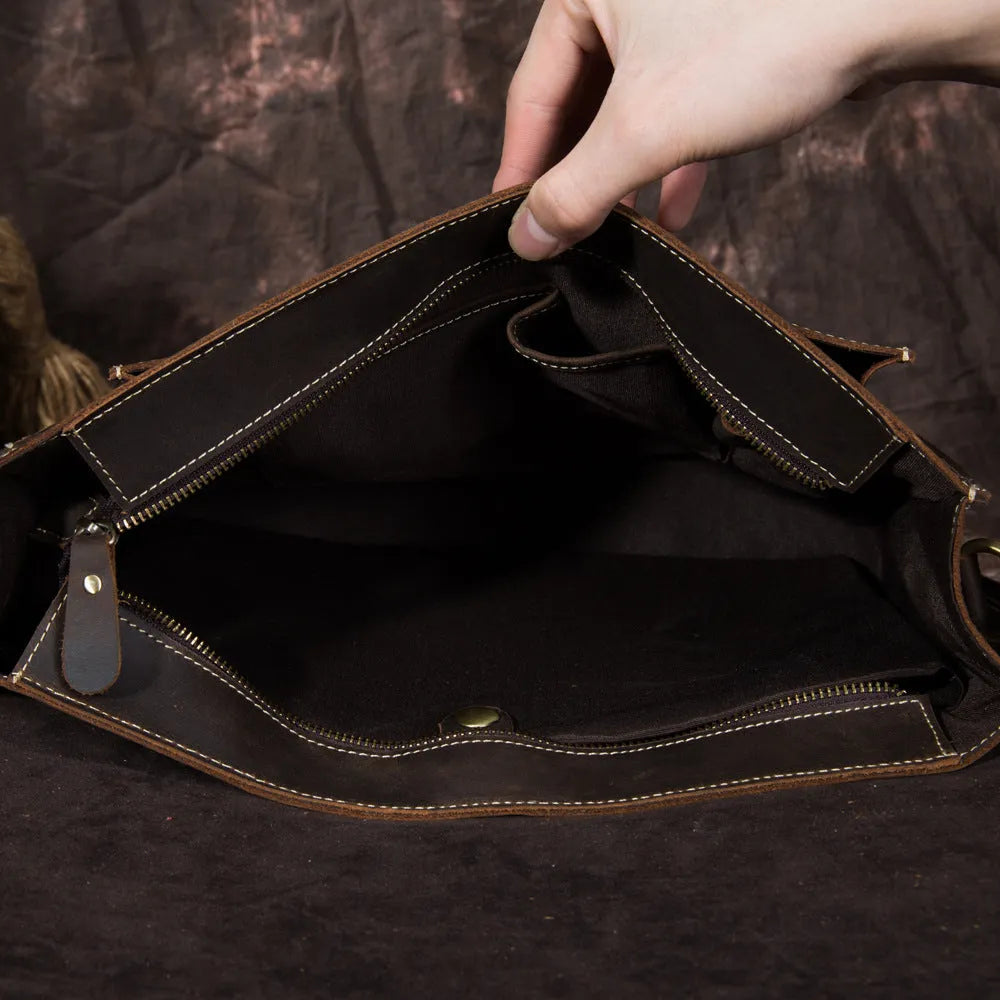 Men's handbag in dark brown coffee first layer crazy horseskin leather, shown as a shoulder bag on a model.