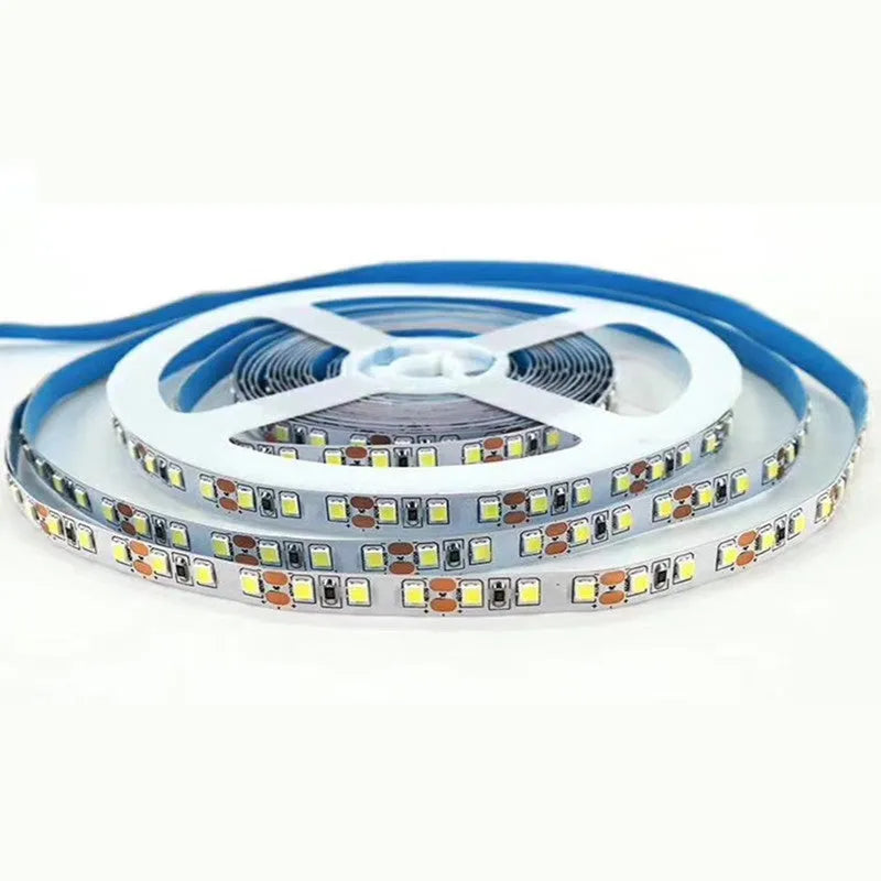 Close-up of a flexible white LED light strip showing 2835 and 5050 chip types for shelf lighting.