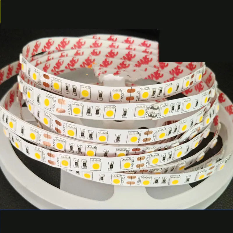 Close-up of a flexible white LED light strip showing 2835 and 5050 chip types for shelf lighting.