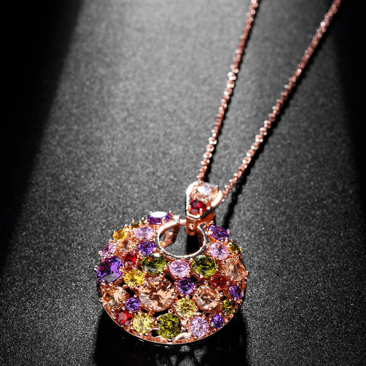 Geometric copper pendant necklace with clear zircon stones, rose gold electroplated finish, on display