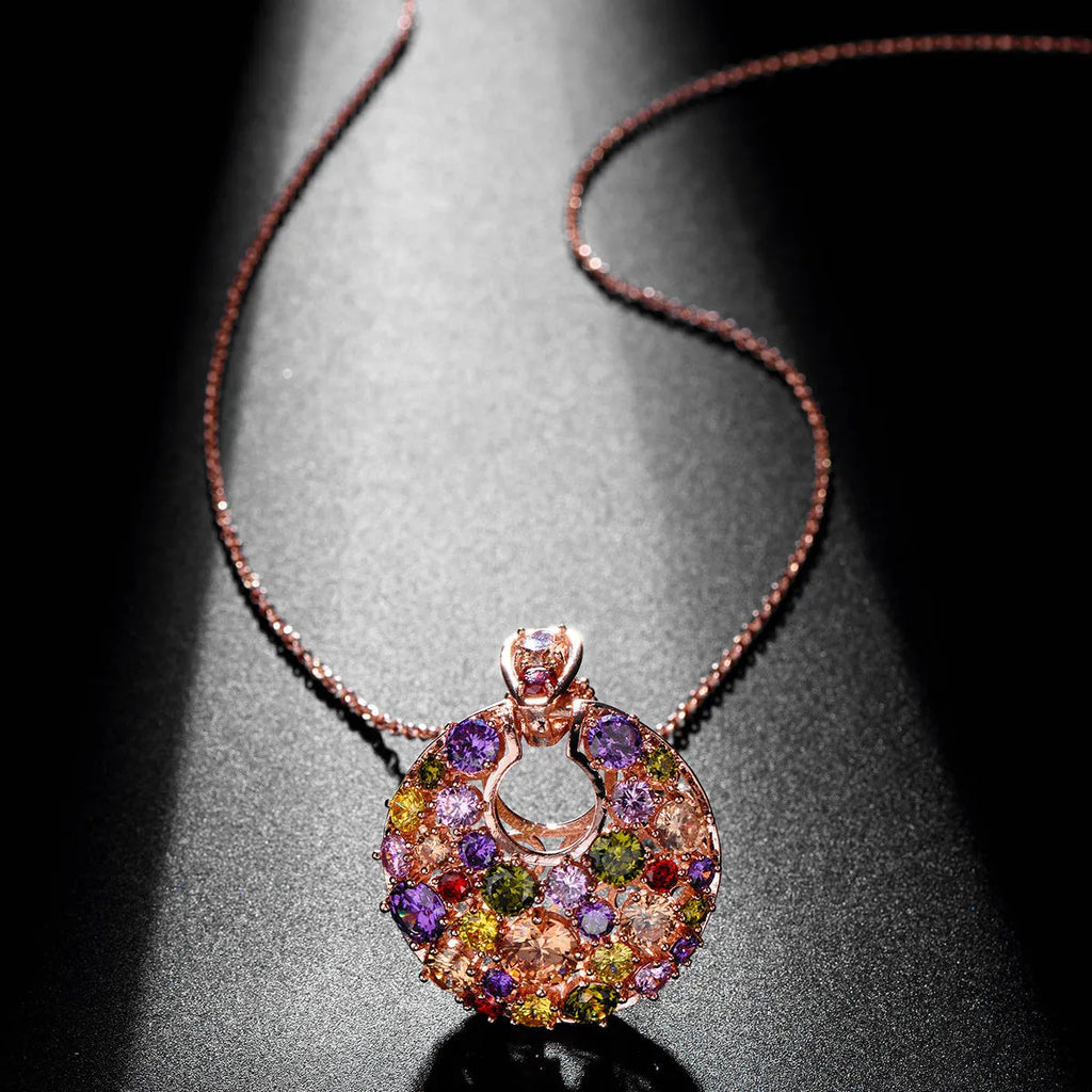Geometric copper pendant necklace with clear zircon stones, rose gold electroplated finish, on display