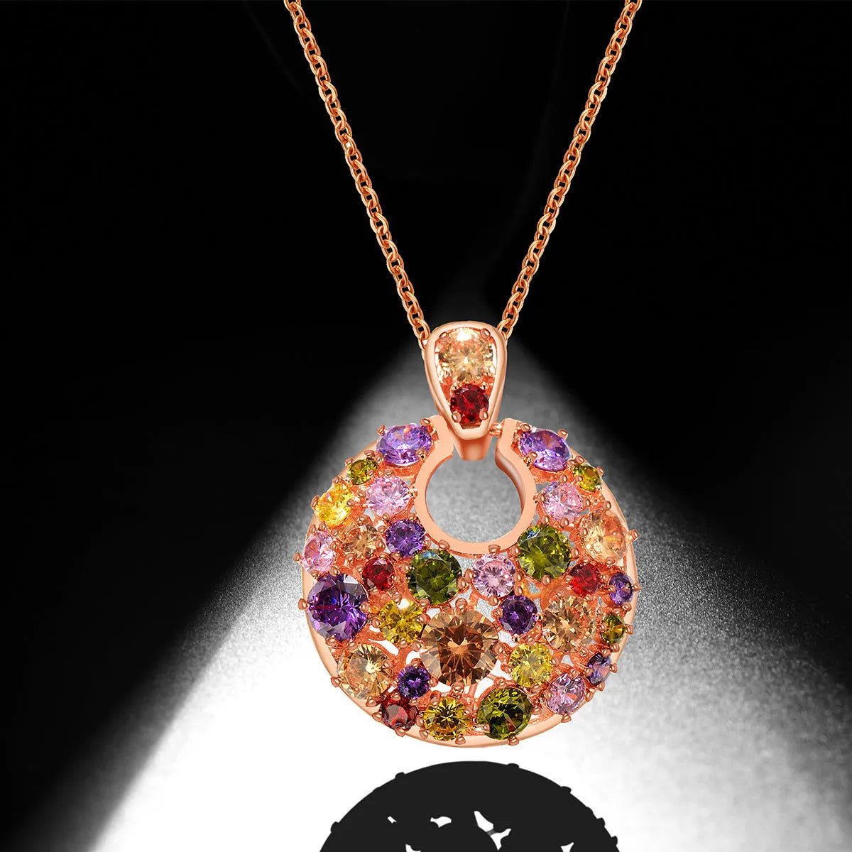 Geometric copper pendant necklace with clear zircon stones, rose gold electroplated finish, on display