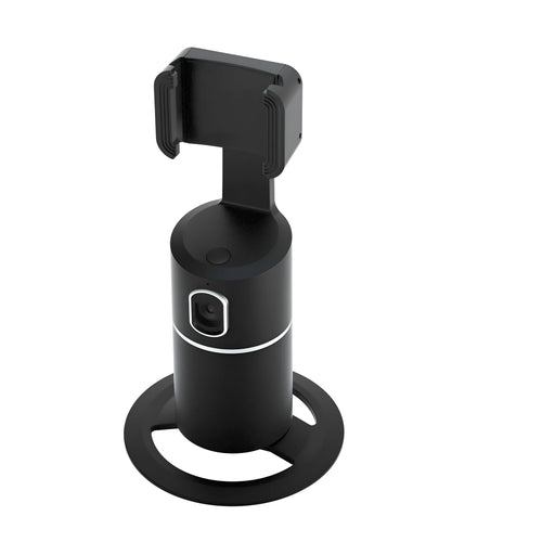 Black smart tracking gimbal stabiliser clipped to a smartphone, showing its rotating head for automated face-following.