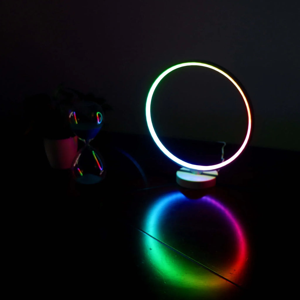 White full moon mood lamp with remote control on table showing warm white and RGB lighting options
