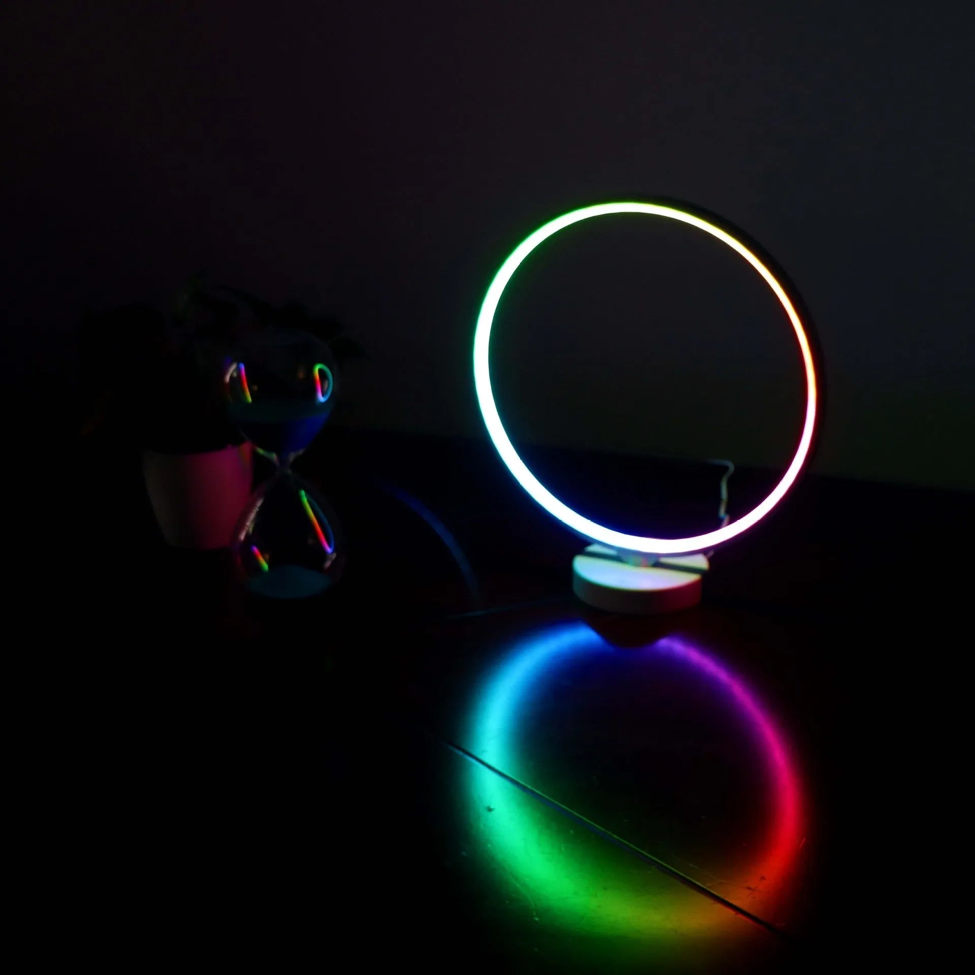 White full moon mood lamp with remote control on table showing warm white and RGB lighting options