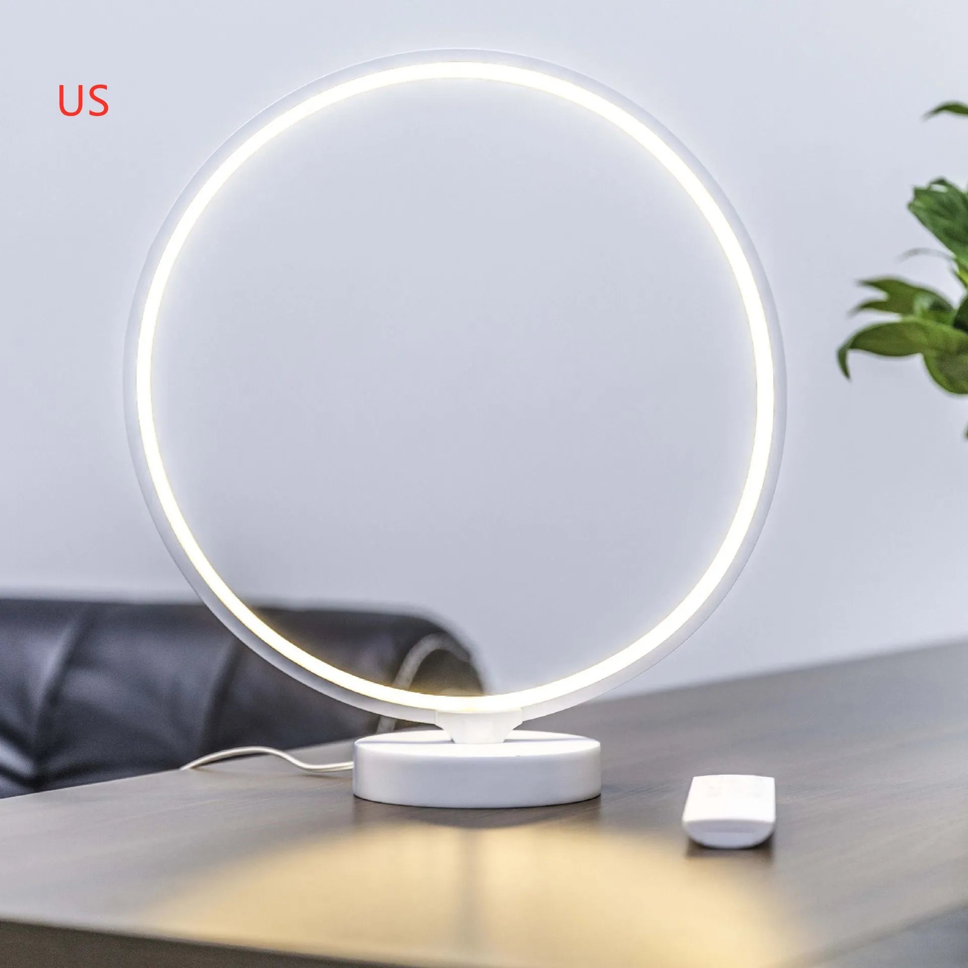 White full moon mood lamp with remote control on table showing warm white and RGB lighting options
