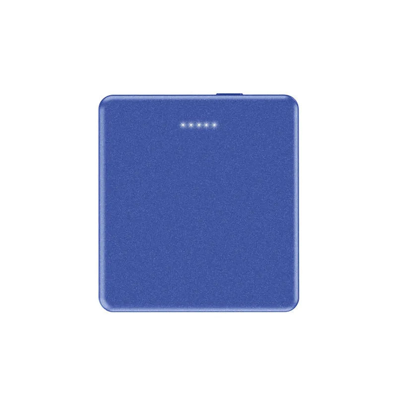 Mini magnetic wireless power bank in blue, displaying 5000mAh capacity and USB ports on a neutral background