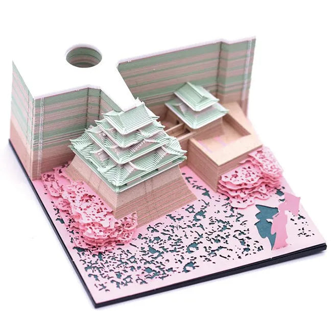 3D paper architectural model of the Tianshou Tower from Spirited Away, shown in gold, pink, and white colour options.