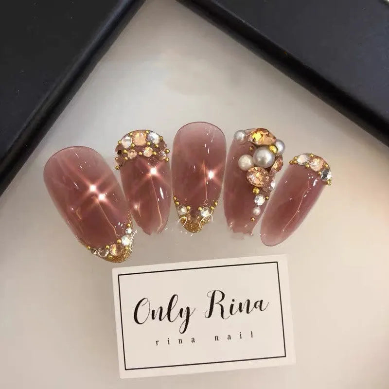 Handmade manicure finished fake nails in light brown colour for bride wear