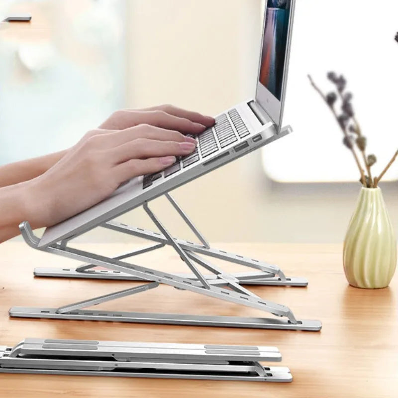 Double-layer aluminium alloy foldable laptop stand in silver with adjustable height up to 310 mm