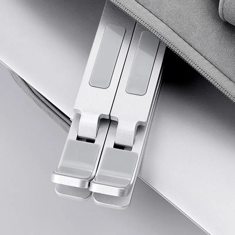 Double-layer aluminium alloy foldable laptop stand in silver with adjustable height up to 310 mm