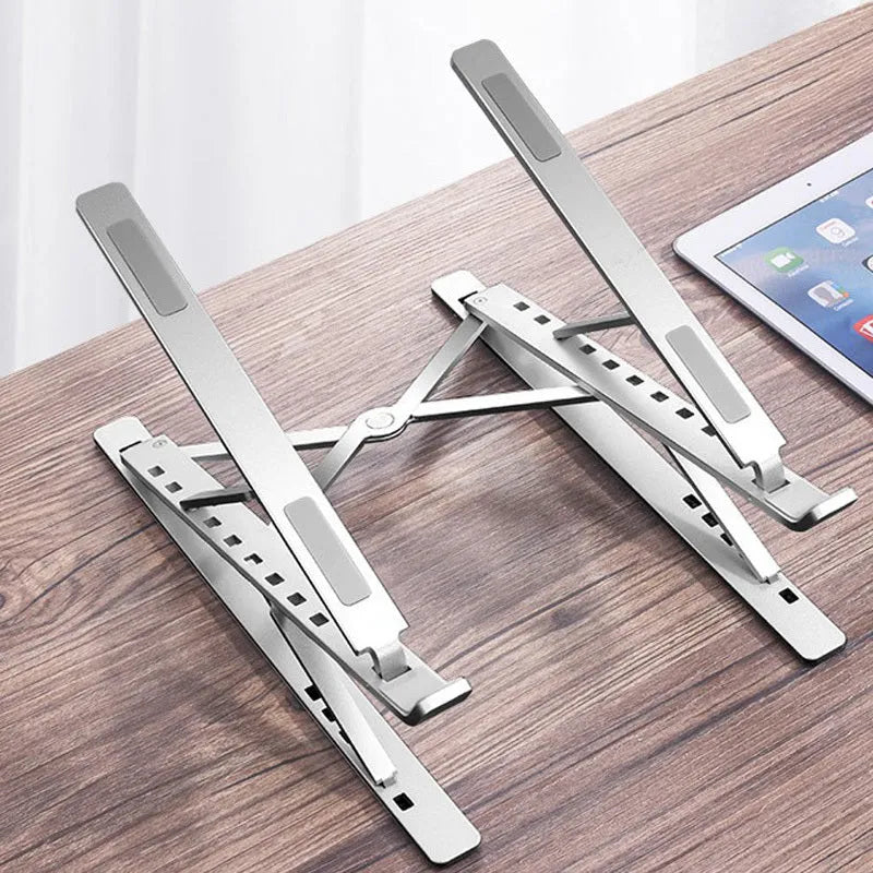 Double-layer aluminium alloy foldable laptop stand in silver with adjustable height up to 310 mm