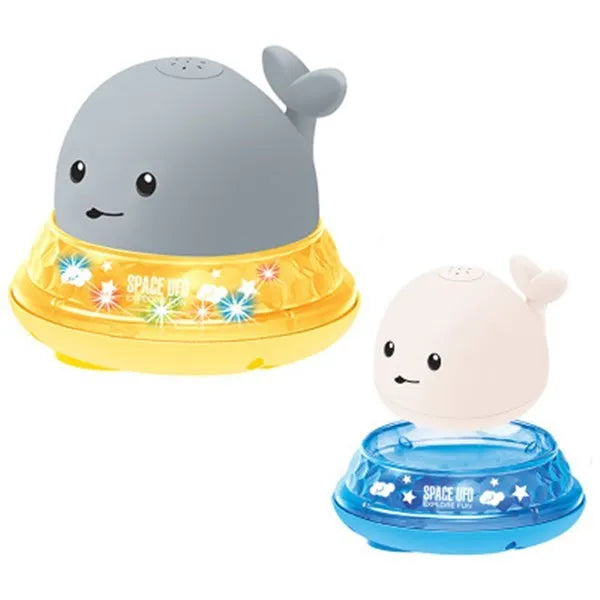 Floating grey and white whale bath toy spraying water with LED lights