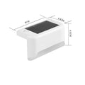 White solar-powered railing light with LED illumination for outdoor steps and garden fencing