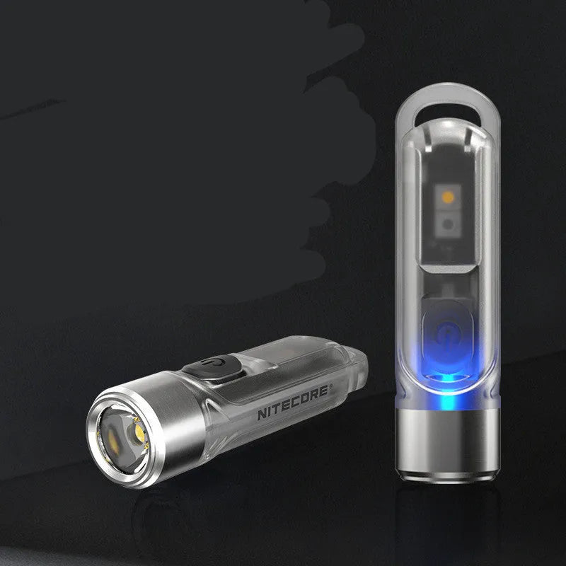 Green Nitecore TIKI USB rechargeable keychain torch with three LED light sources: main, white, and UV.