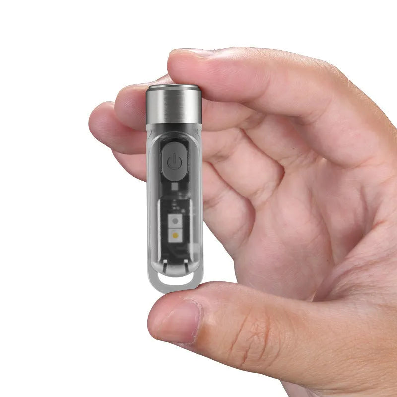 Green Nitecore TIKI USB rechargeable keychain torch with three LED light sources: main, white, and UV.