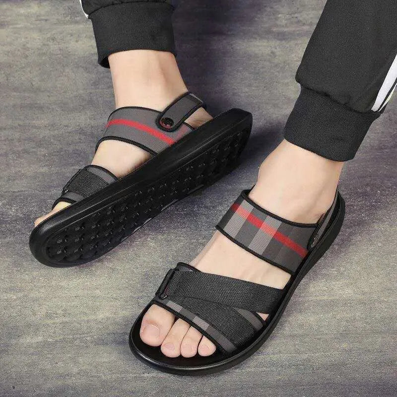 A pair of leisure sports sandals with a Lycra upper and polyurethane sole on a summer background.