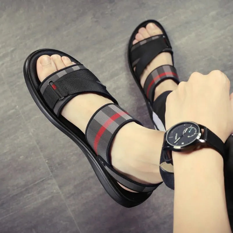 A pair of leisure sports sandals with a Lycra upper and polyurethane sole on a summer background.