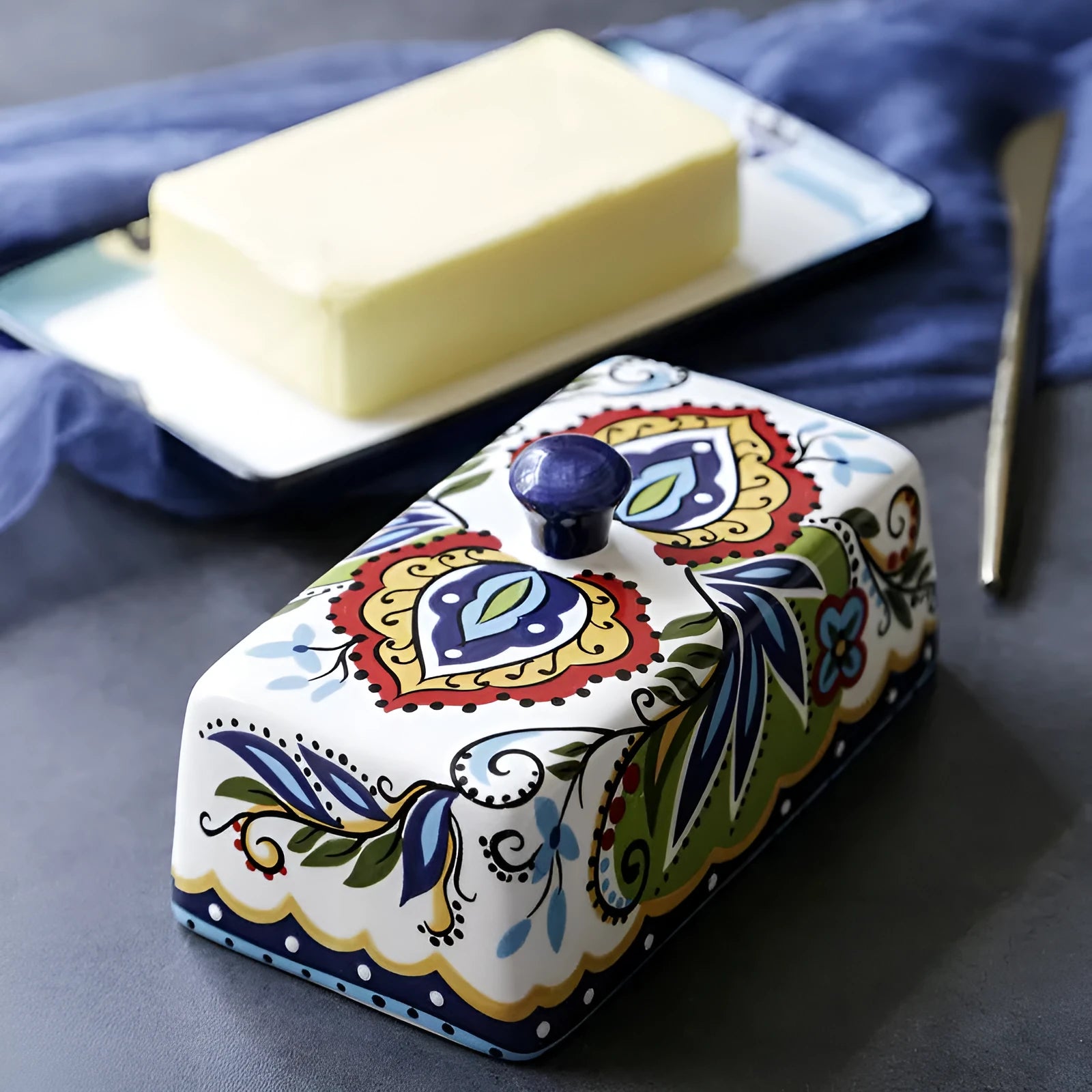 Square ceramic butter box with lid showing floral pattern decoration in blue colour option