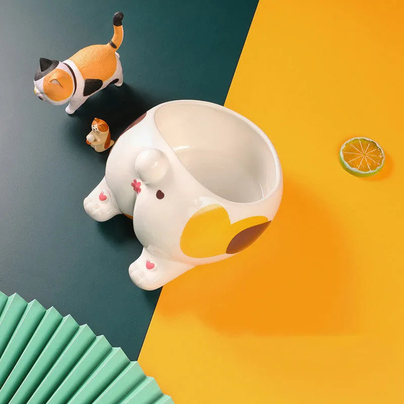 Ceramic pet bowl with inclined mouth design in a cute cat butt shape, suitable for cat or dog food and water