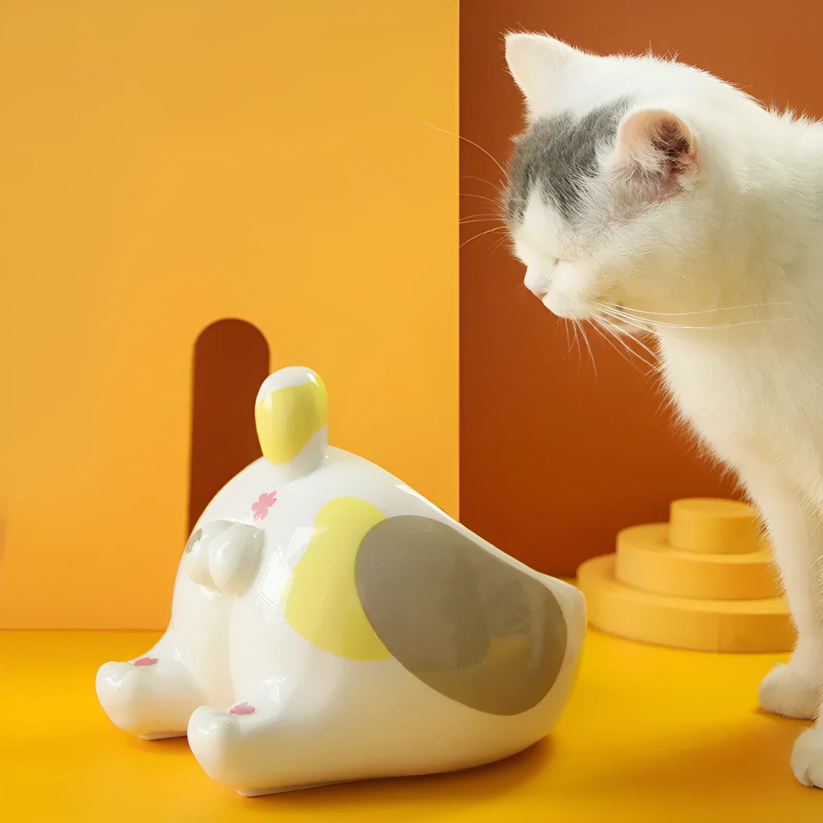 Ceramic pet bowl with inclined mouth design in a cute cat butt shape, suitable for cat or dog food and water