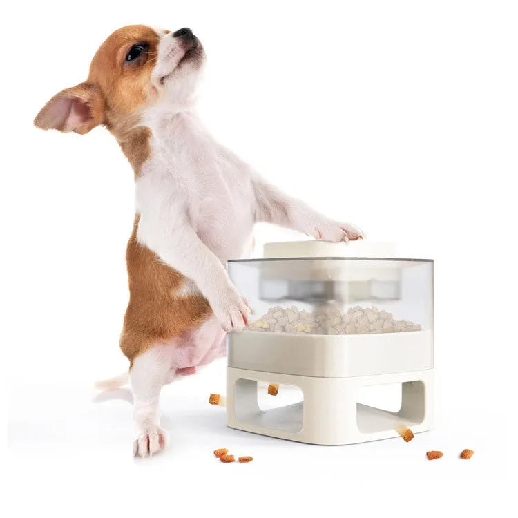 Square bullet-shaped dog food feeder toy in white ABS plastic with suction cups and anti-slip pads on a tiled floor