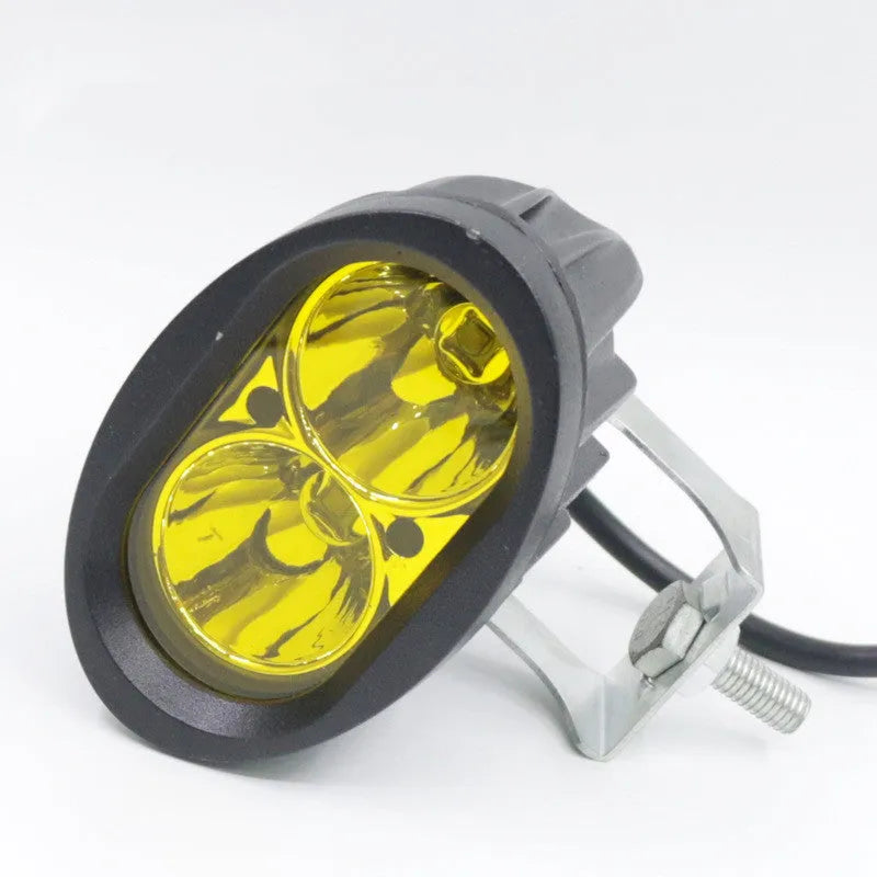 Direct selling motorcycle LED spotlight with aluminium housing in white and yellow light options on dark background