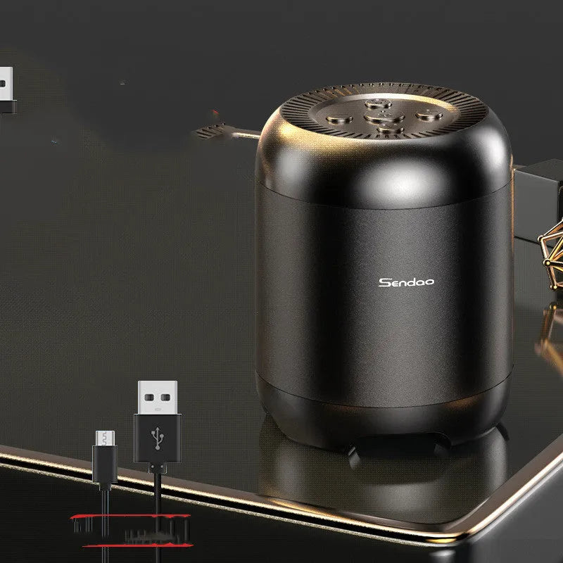 Small black wireless Bluetooth speaker with super subwoofer showing USB port and card reader slot