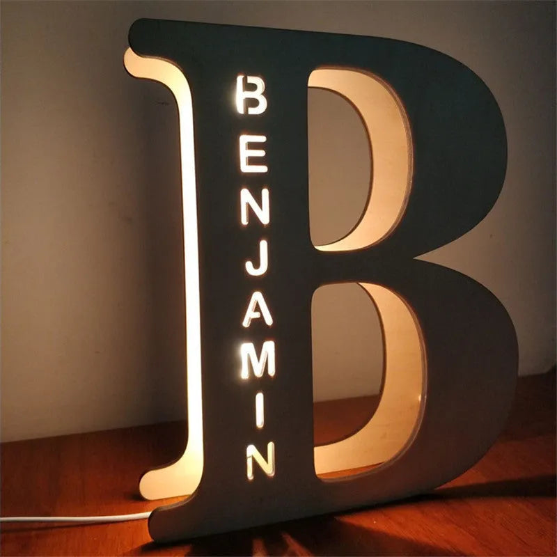 Wooden letter pendulum lamp with custom style option, LED light, and natural wood shell on a tabletop