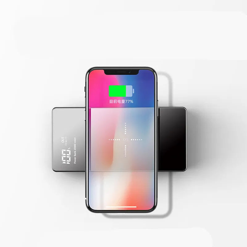 Black wireless power bank with digital display showing battery percentage and two USB charging ports