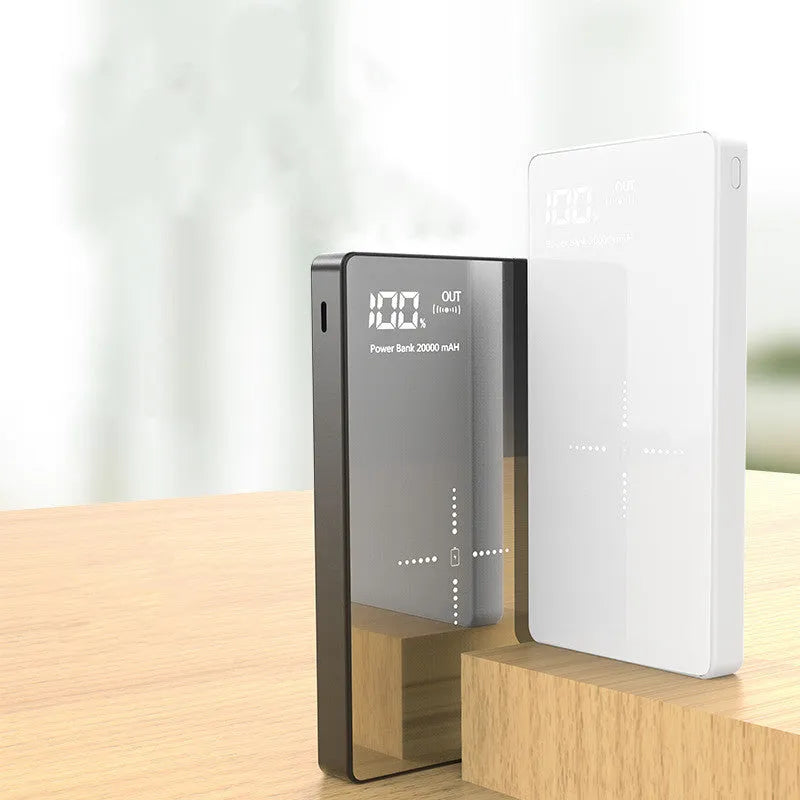 Black wireless power bank with digital display showing battery percentage and two USB charging ports