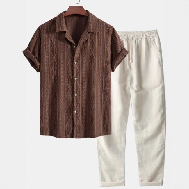 Slim-fit men's camouflage print shirt and trousers casual suit set on a hanger.