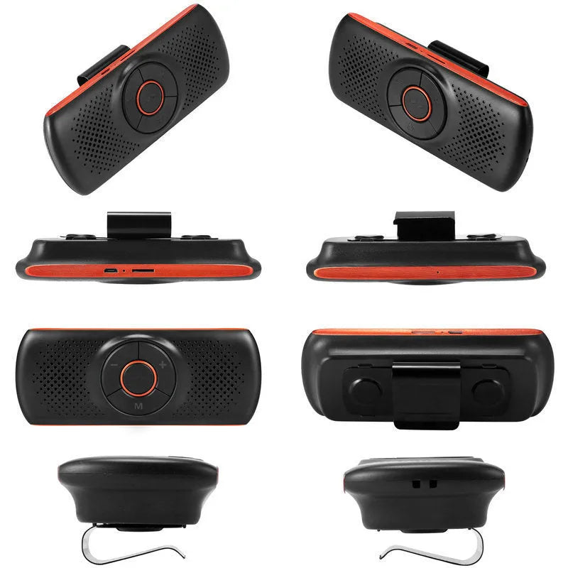 Orange plastic Bluetooth hands-free car speaker kit mounted on a sun visor.