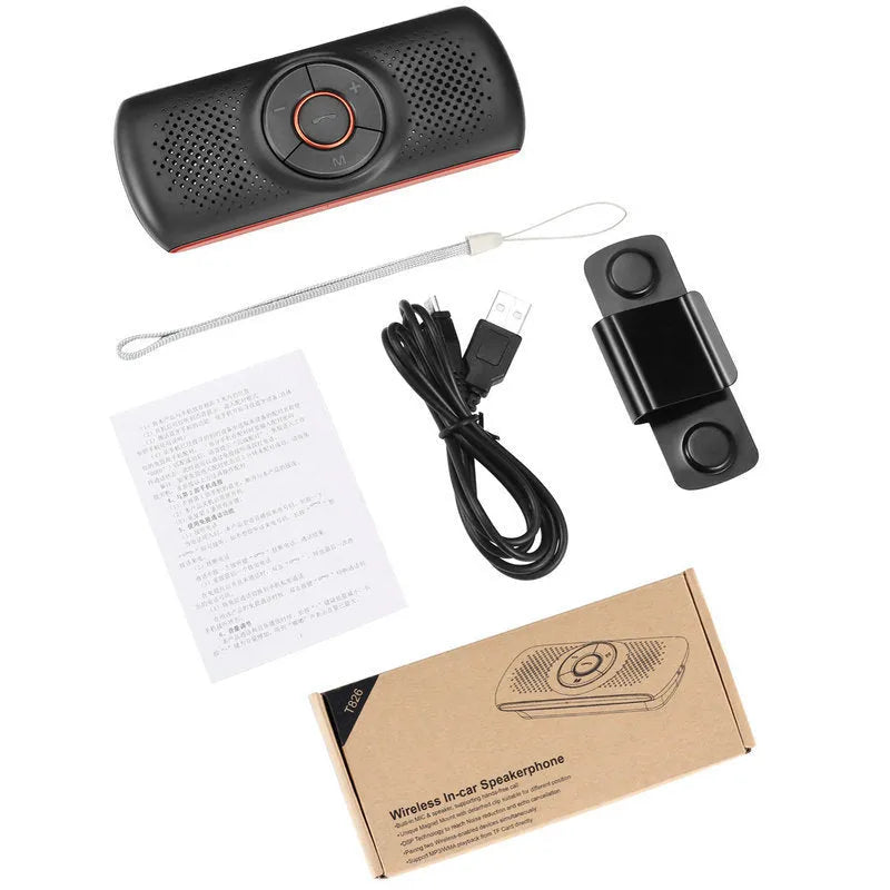 Orange plastic Bluetooth hands-free car speaker kit mounted on a sun visor.