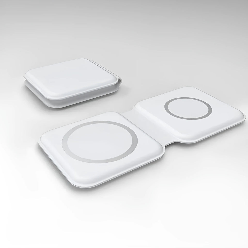 White foldable magnetic wireless charging dock with a phone attached and earbud case on the base.