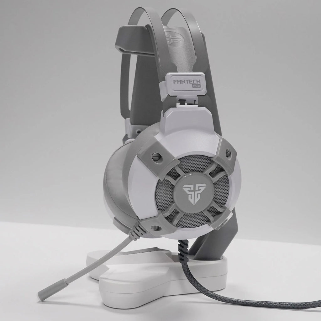 Black FANTECH HG11 USB gaming headset with RGB lights on earcups and an adjustable microphone.