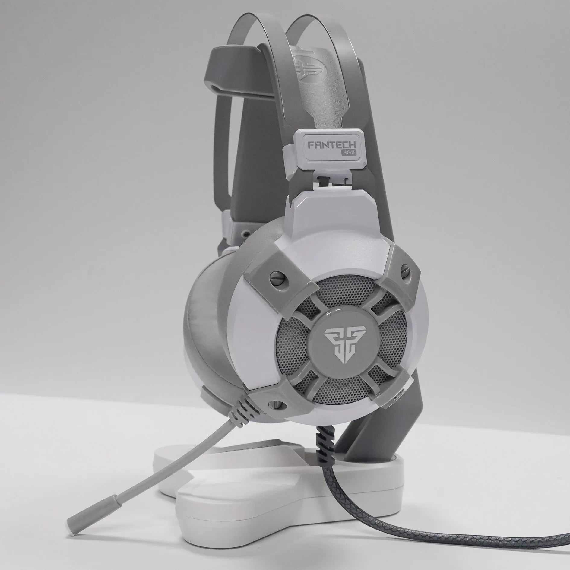 Black FANTECH HG11 USB gaming headset with RGB lights on earcups and an adjustable microphone.
