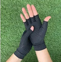 Black copper fibre compression gloves for arthritis, full finger style, showing stretch fabric and textured palm