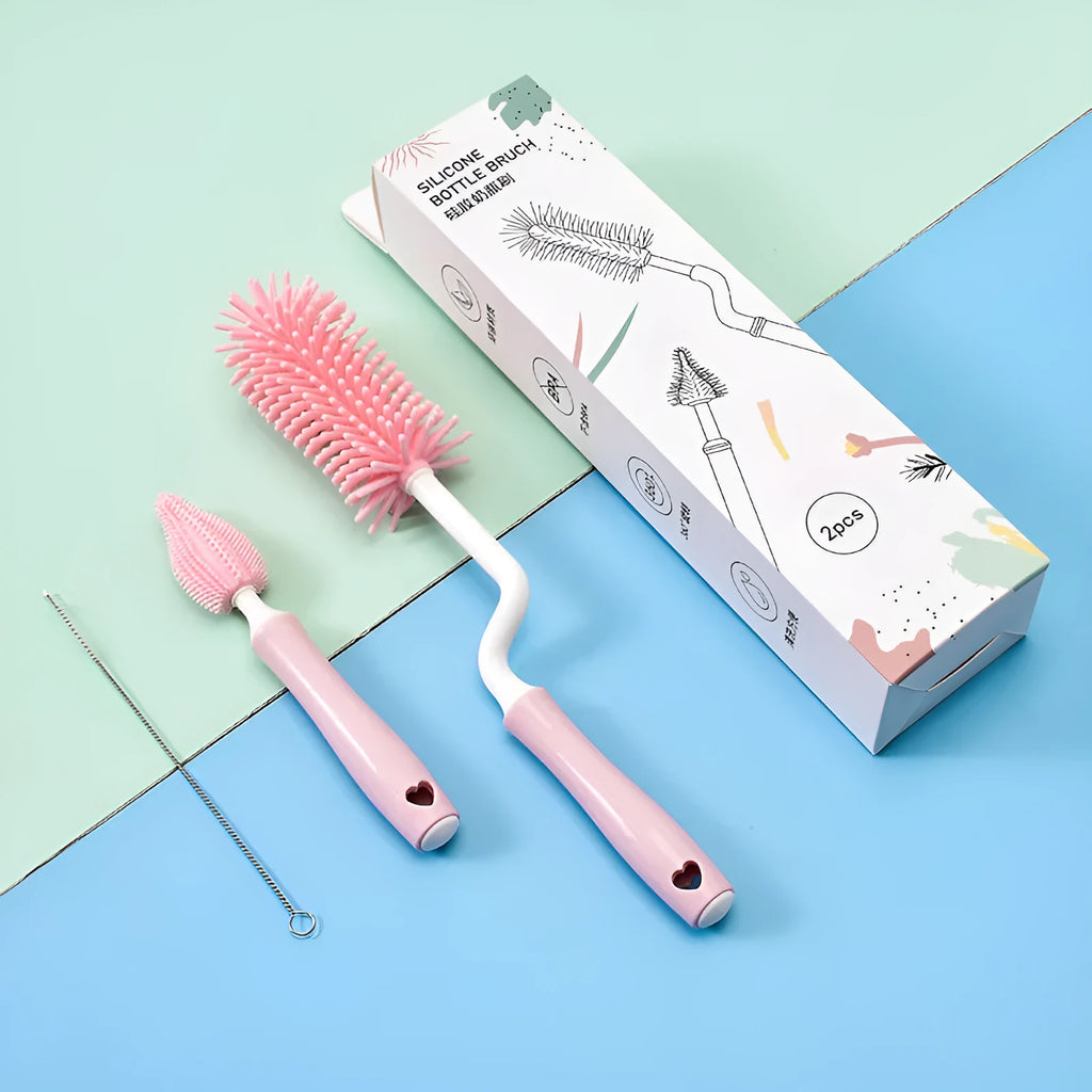 Three silicone baby bottle brushes in pink, blue, and yellow colours including a straw cleaning brush.