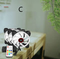 Camouflage patterned 12cm PC case fan with glowing RGB lights on the blades.