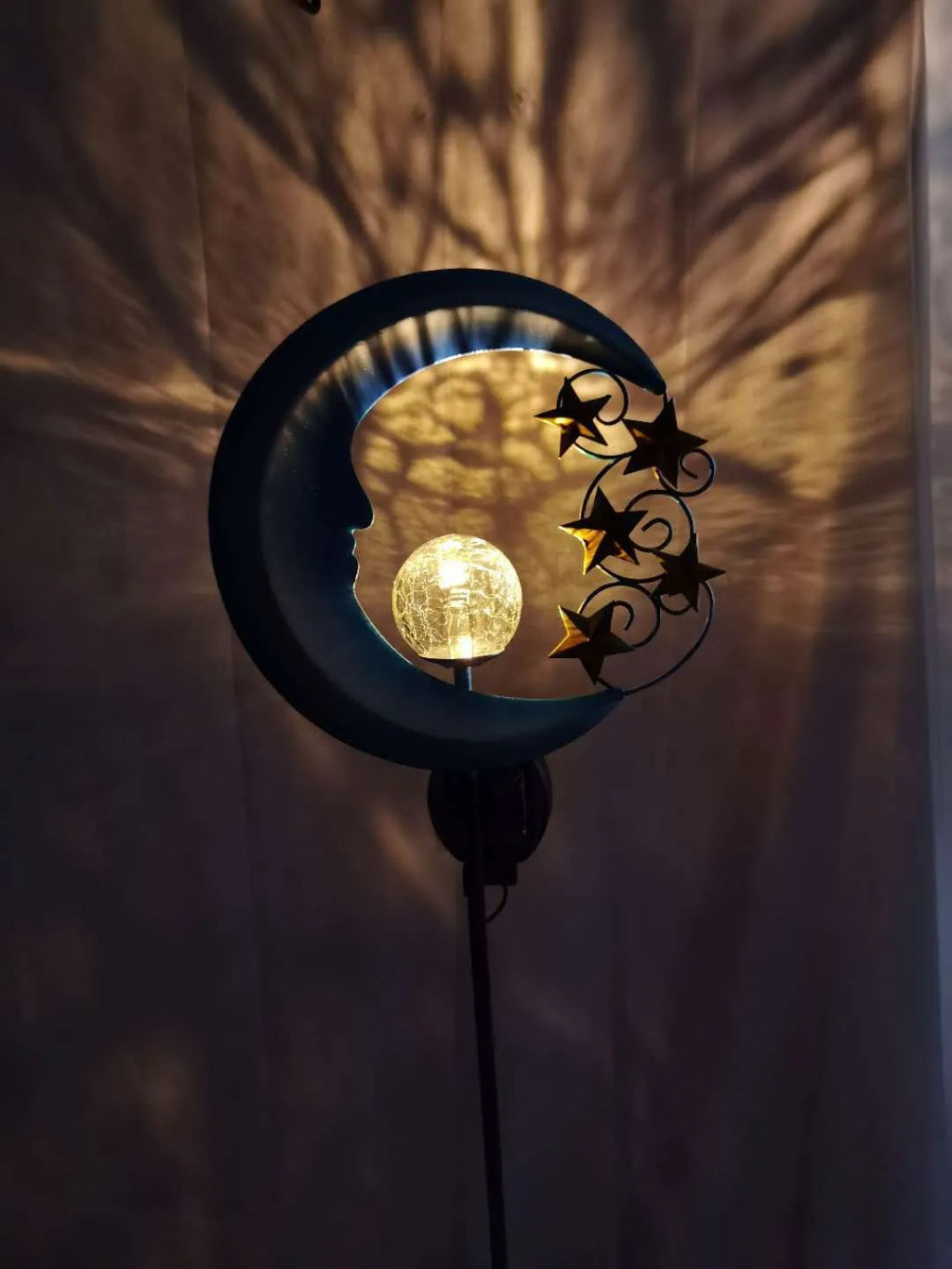 Blue glass ball solar garden light with hollow wrought iron moon pattern design