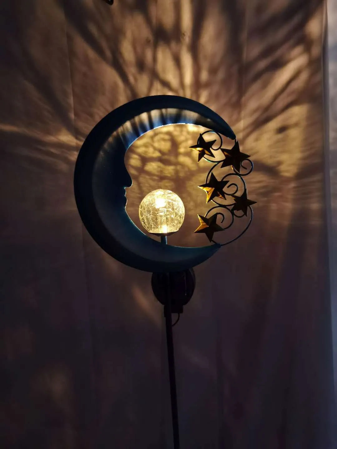 Blue glass ball solar garden light with hollow wrought iron moon pattern design
