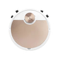 Golden robotic vacuum cleaner with remote control on hardwood floor