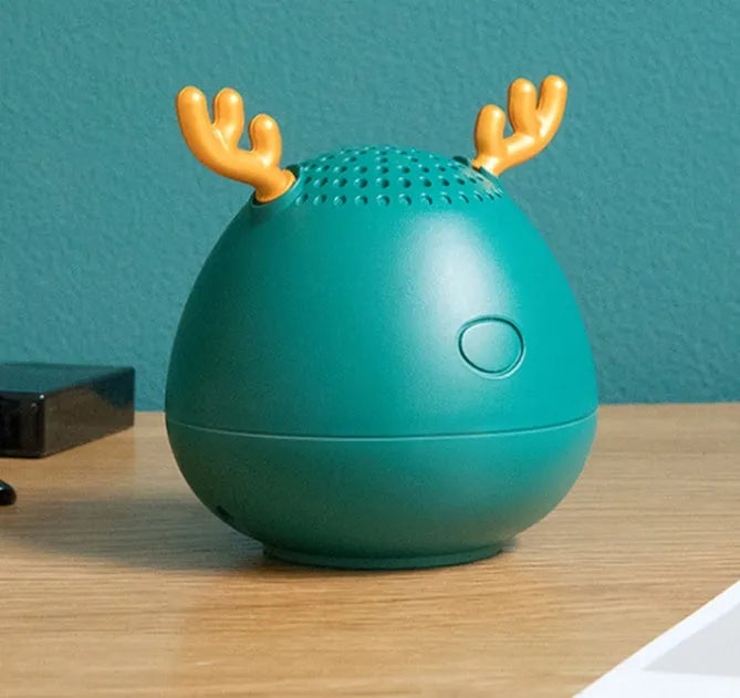 Compact wireless Bluetooth speaker with USB cable in green, pink, or white colour options