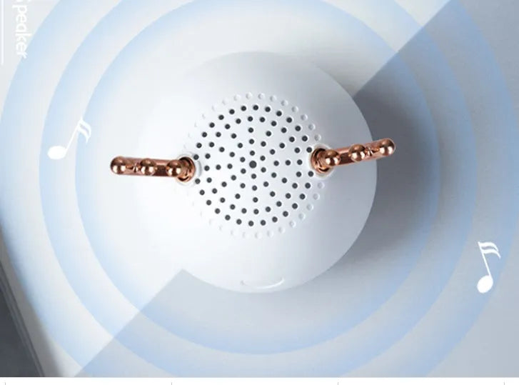 Compact wireless Bluetooth speaker with USB cable in green, pink, or white colour options