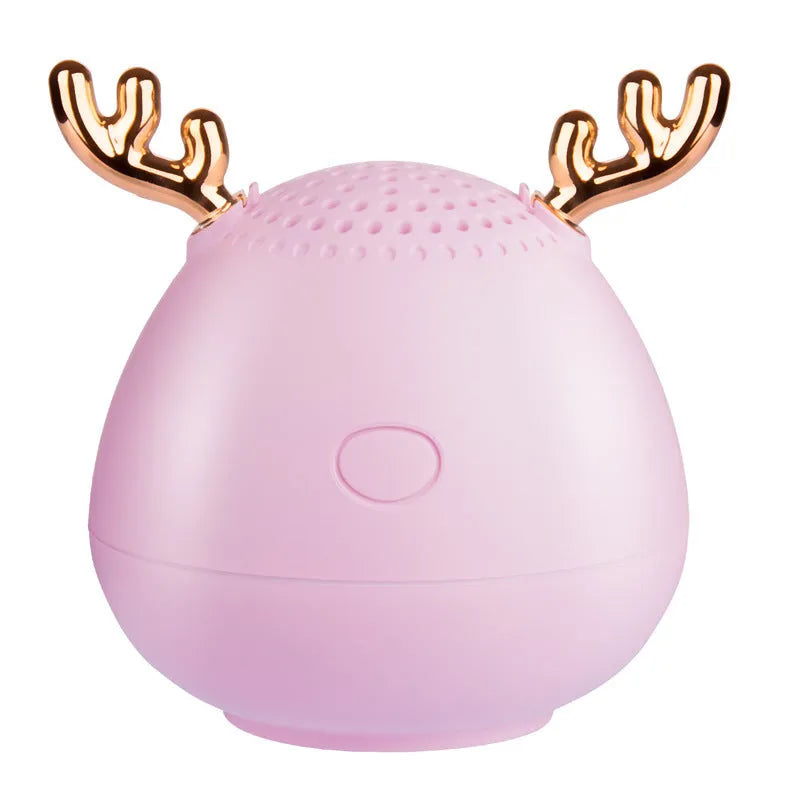Compact wireless Bluetooth speaker with USB cable in green, pink, or white colour options