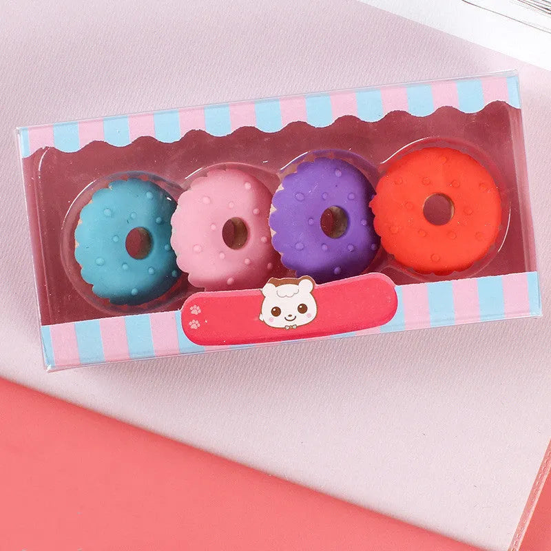 Set of 12 colourful cartoon erasers shaped like ice cream cones, donuts, and lollipops for children.