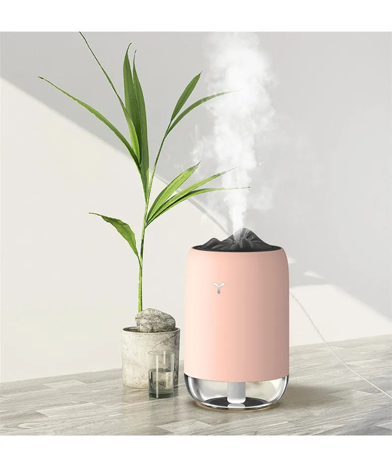 Magic Flame columnar USB humidifier in light blue, pink, or white colours for desktop use